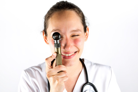 View of a Smiling medical doctor woman with stethoscope on a white backgroundの写真素材