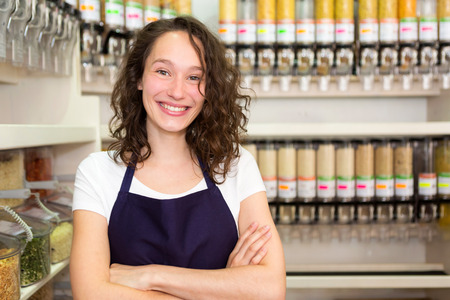 View of a Young attractive woman working at the grocery store