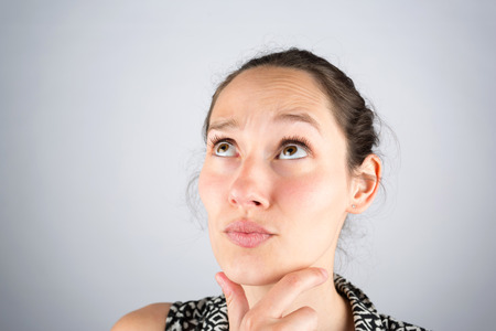 View of a beautiful woman cogitate isolated on a white background