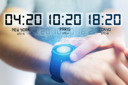 Jet lag concept view with different hour time over a smartwatch