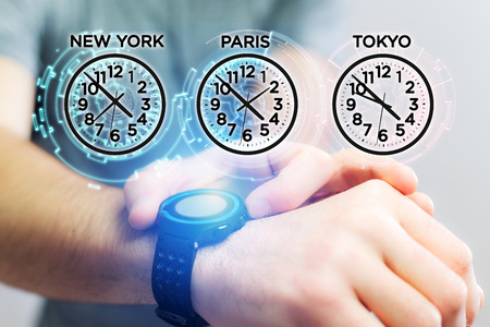 Jet lag concept view with different hour time over a smartwatch
