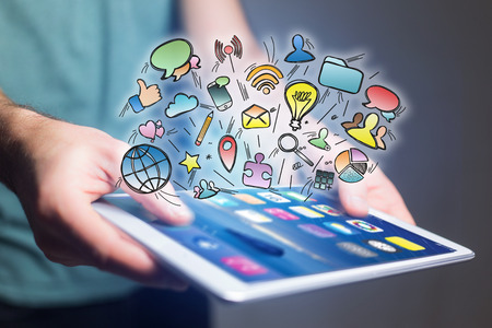 Concept view of creative mulitmedia icons flying over a technology interface - Creativity conceptの写真素材