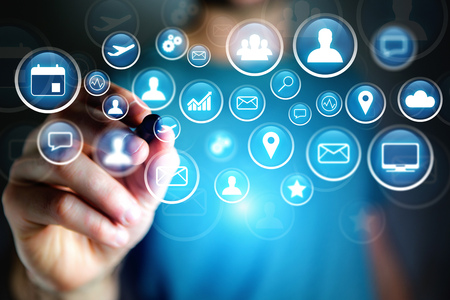 Concept view of multimedia icon flying over device on a technology interface - Internet concept
