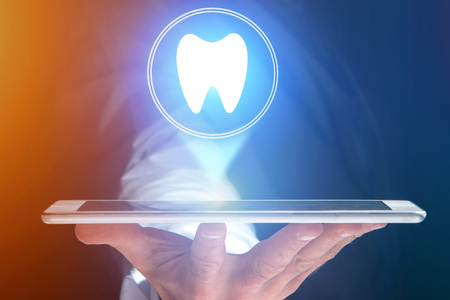 Concept view of making an appointement with a dentist on internet - technology conceptの写真素材
