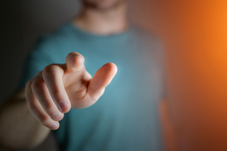 View of the Finger of a man holding at youの写真素材