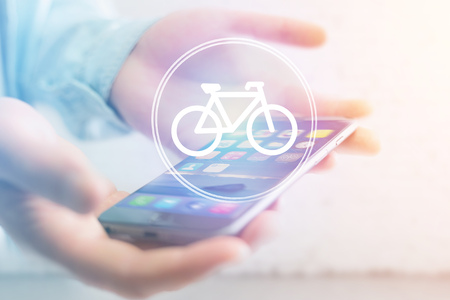View of a Bicycle icon over device - Sport and technology conceptの写真素材