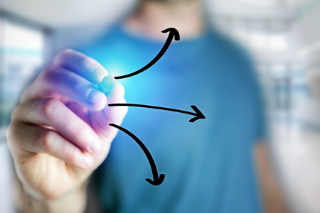 View of a Man hand drawing arrows icon on a futuristic interface - technology conceptの写真素材