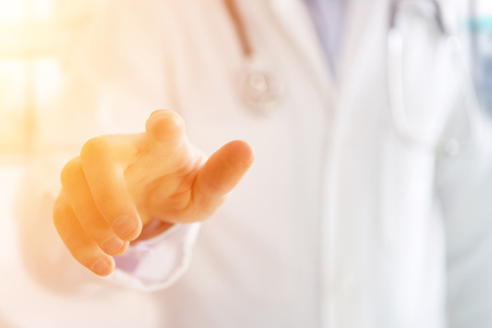 View of a Finger of a doctor holding at youの写真素材