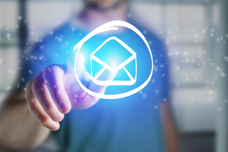View of a Man touching a email icon on a futuristic interface - Technology conceptの写真素材