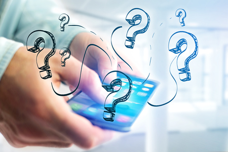 View of Hand drawn question mark icon going out a smartphone interface of a man at the office - technology conceptの写真素材
