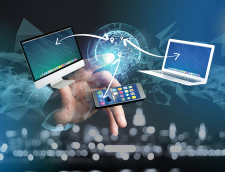 View of a Computer and devices displayed on a futuristic interface with interantional network -...