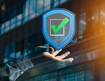 View of a Shield symbol displayed on a futuristic interface - Security and internet conceptの写真素材