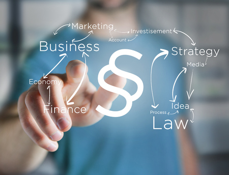 View of a Justice and law symbol displayed on a futuristic interface with business terms - technology and inspiration conceptの写真素材