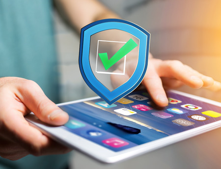 View of a Shield symbol displayed on a futuristic interface - Security and internet conceptの写真素材