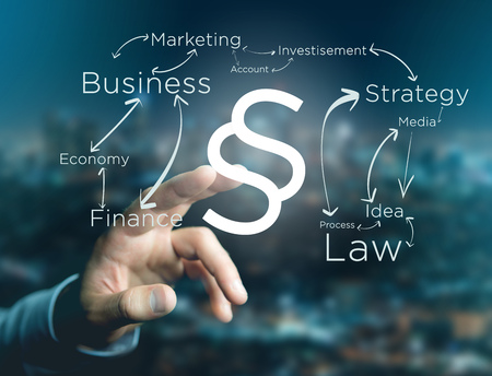 View of a Justice and law symbol displayed on a futuristic interface with business terms - technology and inspiration conceptの写真素材