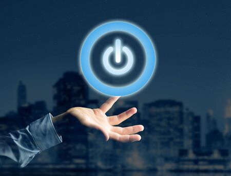 View of a Power button symbol displayed on a futuristic interface - Technology and energy conceptの写真素材