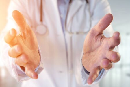 View of a Doctor giving an empty hand at the hospitalの写真素材