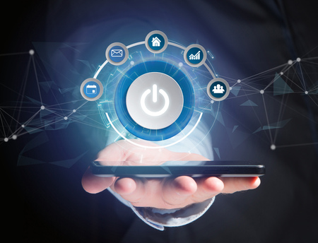 View of a Power button symbol with computer app displayed on a futuristic interface
