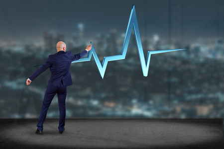 View ofa Businessman in front of a wall with 3d rendering heart beat line の写真素材