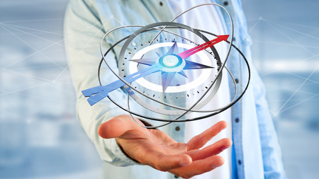 View of a Business man holding a navigation compass - 3d renderedの写真素材