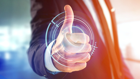 View of a Businessman holding a Shinny technologic phone button - 3d renderの写真素材