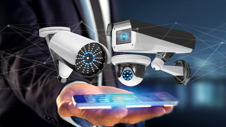 View of a Businessman using a smartphone with a Security camera system and network connection - 3d renderingの写真素材