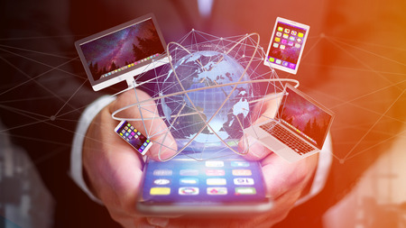 View of a Businessman holding a Computer and devices displayed on a smartphone interface with...
