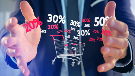 View of a Businessman holding a Red and white Trolley and sales discount - 3d renderの写真素材