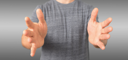 View of a Empty holding hands of a young relaxed man の写真素材