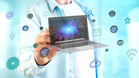 View of a Businessman holding a Computer surrounding by app and social icon - 3d render 