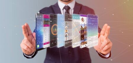 View of a Businessman holding 3d rendering app template on a smartphone