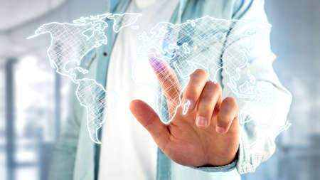 View of a Businessman holding a Hand drawn world map on a futuristic interface