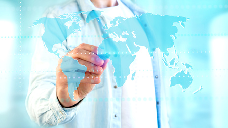 View of a Businessman holding a Connected world map on a futuristic interface - 3d render