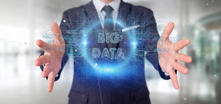 View of a Particles big data title holding by a businessmanの写真素材