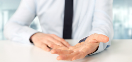 View of a Empty holding hands of a  businessman over a deskの写真素材
