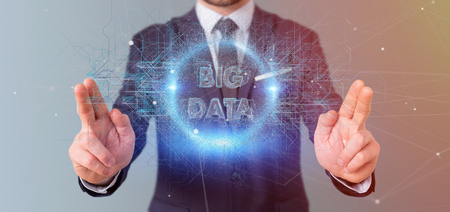 View of a Particles big data title holding by a businessmanの写真素材