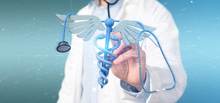 View of a Doctor holding a 3d redering medical cadaceus and stethoscopeの写真素材