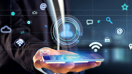 View of a Businessman using a smartphone with a Contact icon surrounding by app and social icon - 3d...