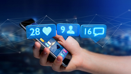 View of a Businessman using a  smartphone with a Like, Follower and message notification on social...