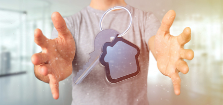 View of a Man holding a Key and house 3d renderingの写真素材