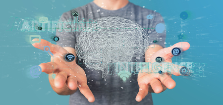 View of a Man holding a 3d rendering artificial intelligence concept with a brain and appの写真素材