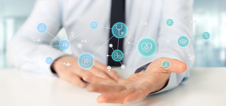 View of a Businessman holding Medical icon and connection 3d renderingの写真素材