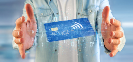 View of a Man holding a contactless credit card payment concept 3d renderingの写真素材