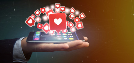 View of a Businessman holding Like notification on a social media 3d rendering