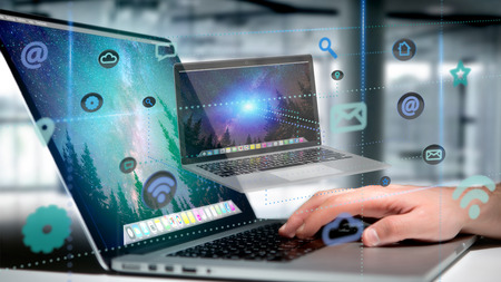 View of a Businessman holding a Computer surrounding by app and social icon - 3d render