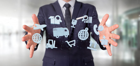 View of a Businessman holding a Logistic organisation with icon and connection 3d renderingの写真素材