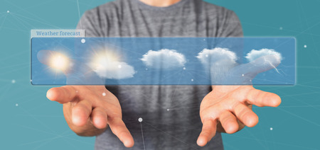View of a Businessman holding a Weather Forecast widget 3d renderingの写真素材