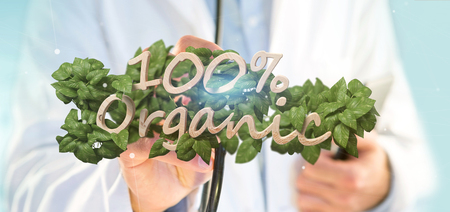 View of a Doctor holding a Wooden logo 100 % organic with leaves around 3d renderingの写真素材