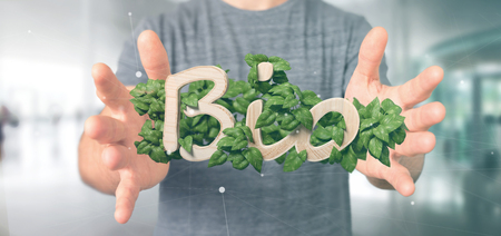View of a Businessman holding Wooden  bio with leaves around 3d renderingの写真素材