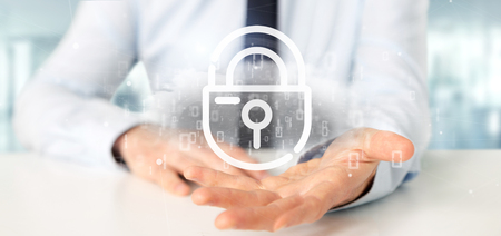 View of a Businessman holding a Binary cloud with internet security padlock 3d renderingの写真素材
